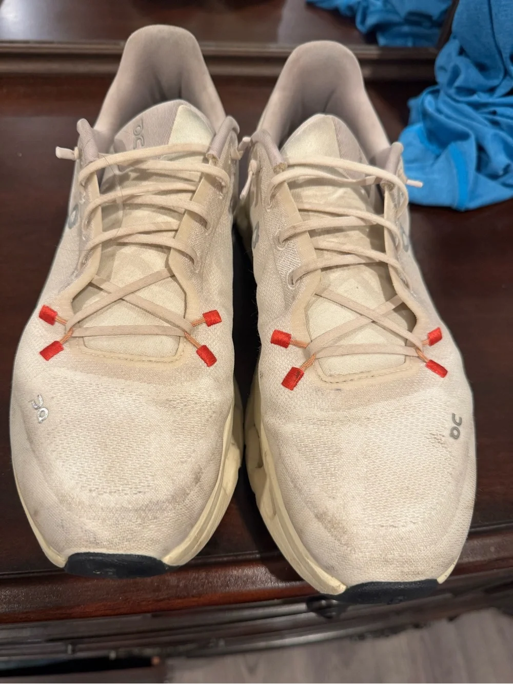 On Running Men’s Athletic Shoes in Cream with Red Accents